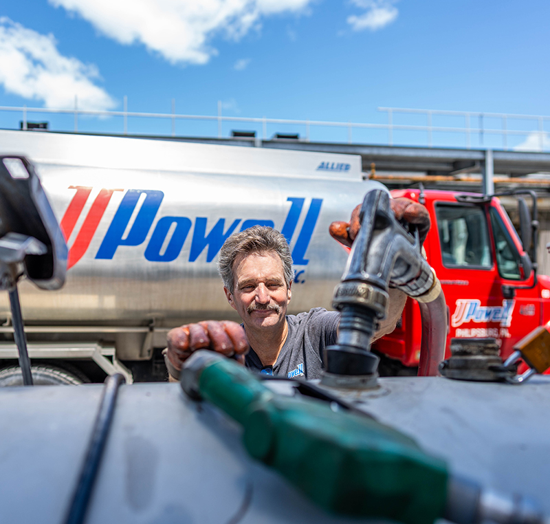 Rich Hosterman fills a commercial  fuel tank with off-road diesel for JJ Powell at a State College construction site.